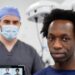 Afro hair transplant consultation in a modern clinic, featuring a patient with natural curly hair alongside a hair transplant surgeon, highlighting specialized expertise in textured and coily hair restoration.